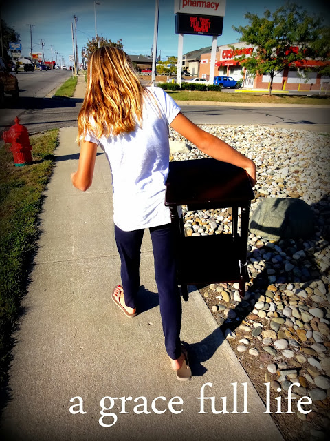 Anna carrying a new table in Ft Wayne Indiana
